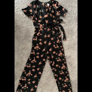 Black floral short sleeved, floor length, wide-leg pant romper.